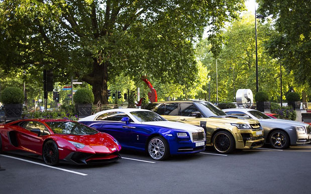 Three gold cars from Saudi Arabia (left-right) a 6x6 Mercedes G 63, Rolls-Royce Phantom Coupe and Lamborghini Aventador have received parking tickets on Cadogan Place in Knightsbridge, London. PRESS ASSOCIATION Photo. Picture date: Wednesday March 30, 2016. See PA story TRANSPORT Knightsbridge. Photo credit should read: Stefan Rousseau/PA Wire 